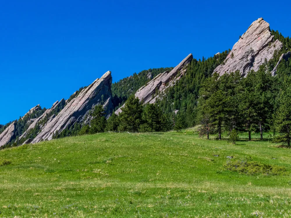 Remarkable rock formation of the Flatirons and flourishing greeneries in Chautauqua Park are some of the things to spectate in the best hikes near Denver