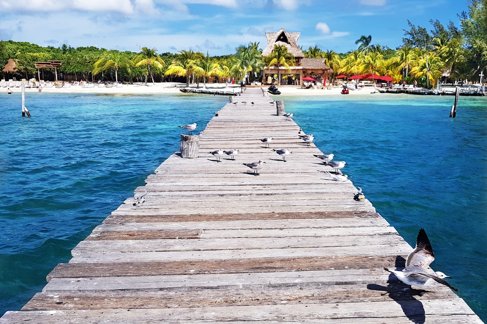 Picturesque photo of a pier in Isla Mujeres, taken during the best time to visit Cancun