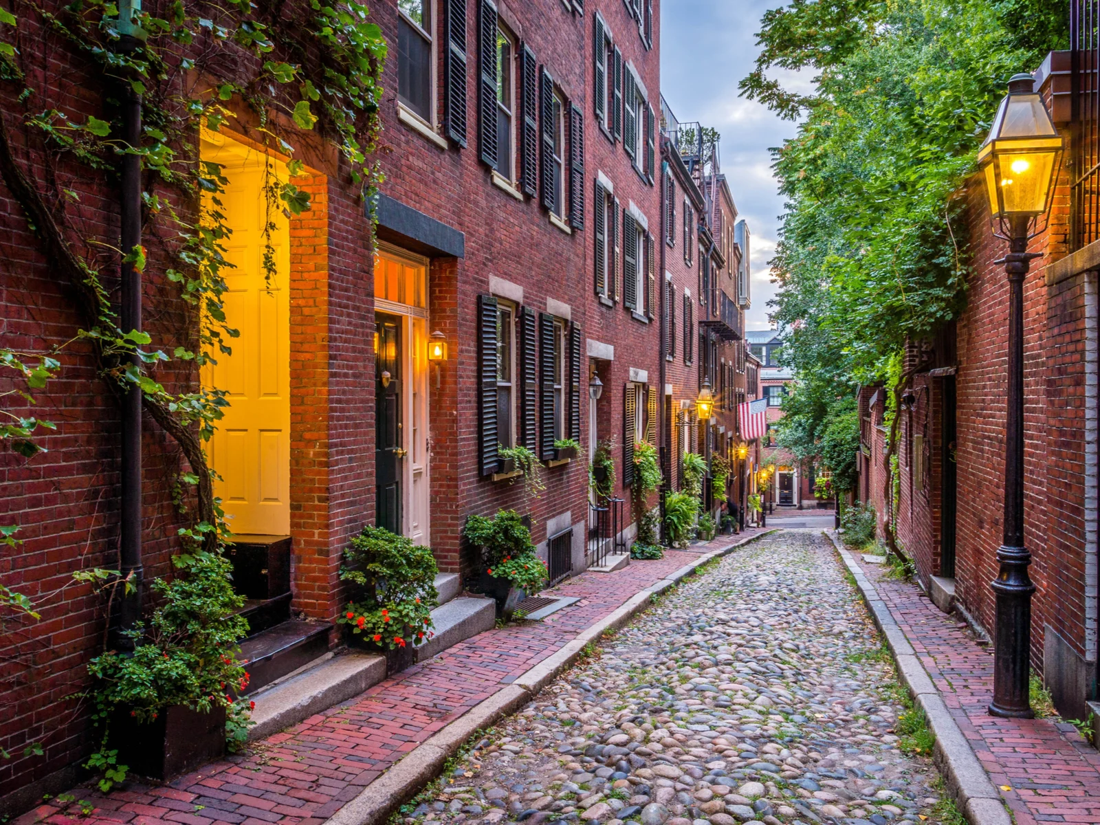 Acorn street pictured in Summer for a piece titled Where to Stay in Boston