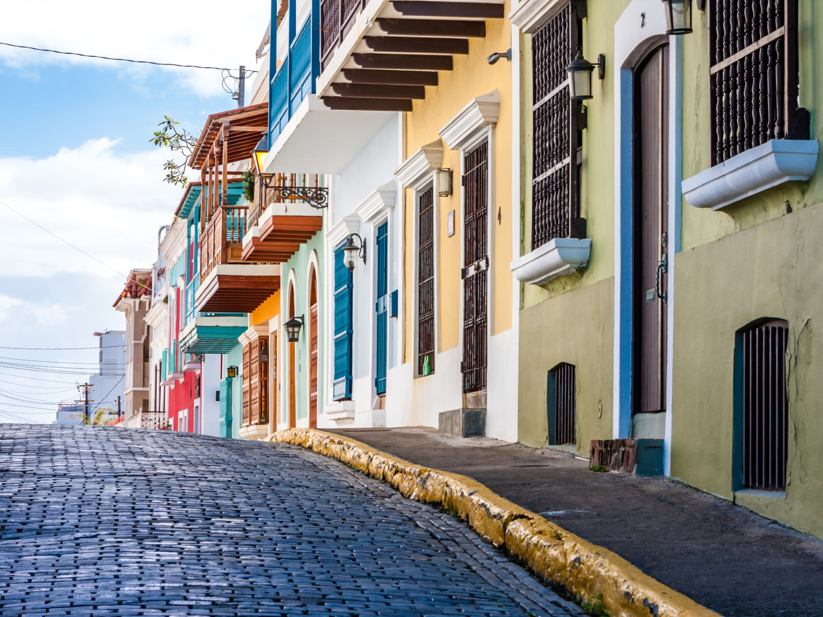 Several of the best hotels in Puerto Rico lining a brick street