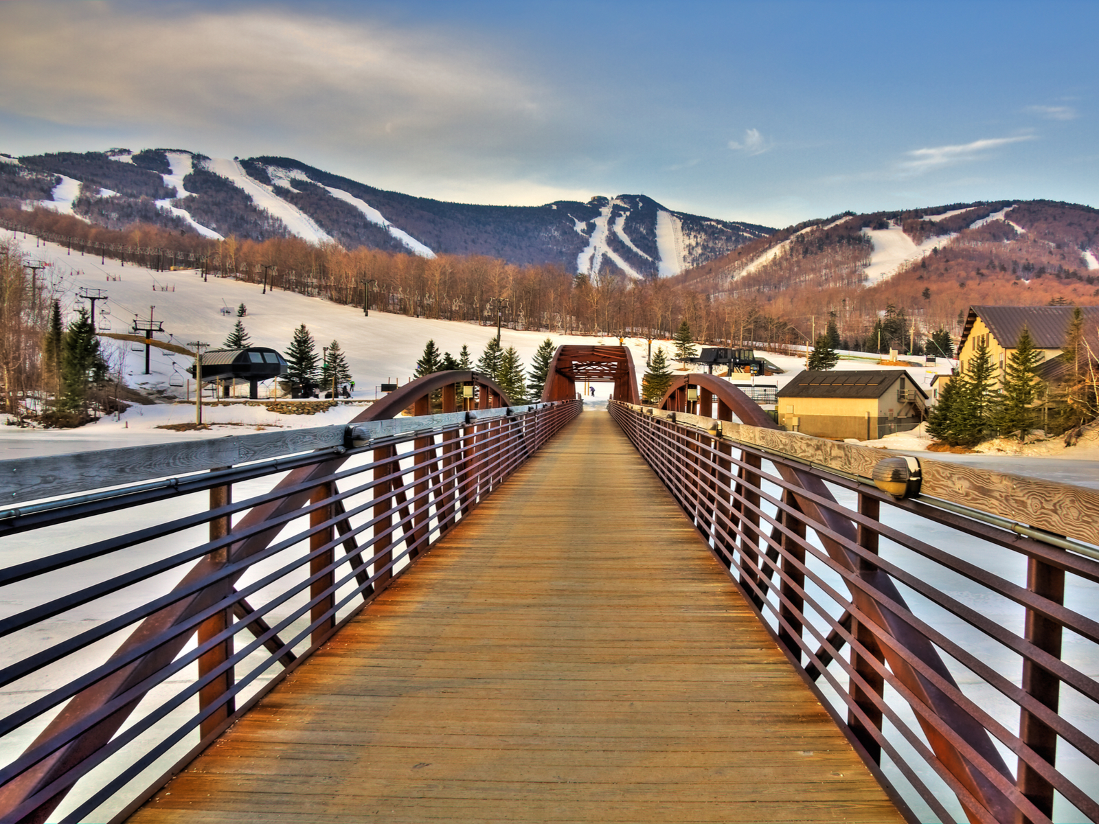 Bridge over a frozen river at the Killington Ski Resort, one of the best places to visit in Vermont
