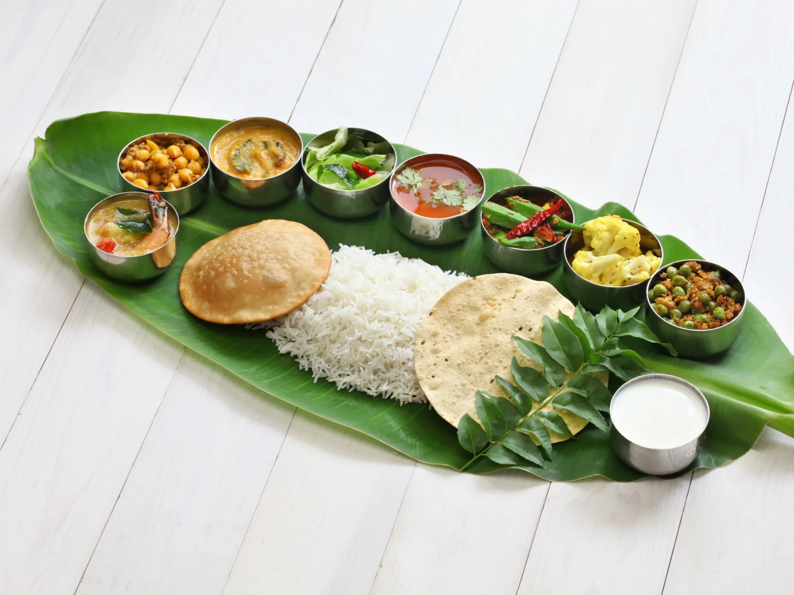 Various dishes served on a fresh banana leaf at Treetop Restaurant and Bar, one of the best restaurants in St. Lucia