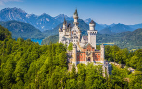 Neuschwanstein Castle on a hillside for a piece on one of the best castles in Germany