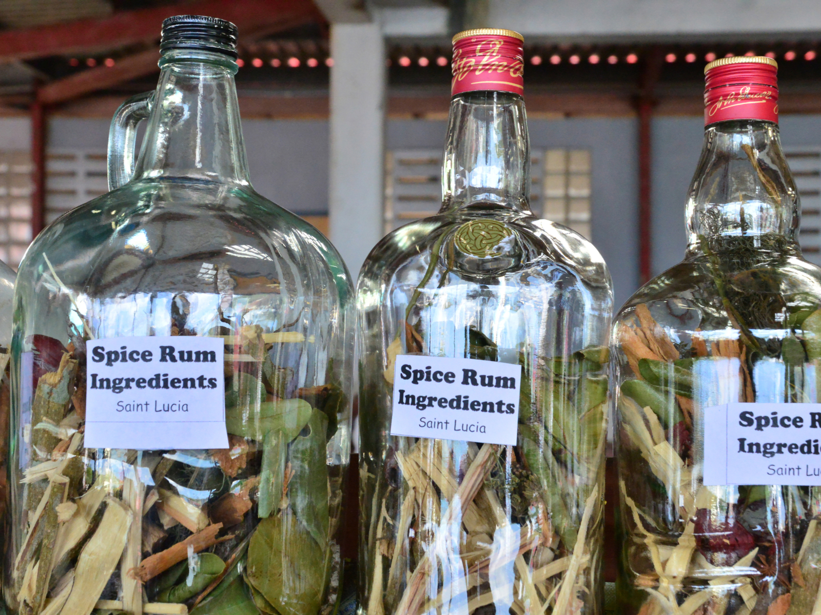 Rum tour pictured with bottles on a table, one of the best things to do in Saint Lucia
