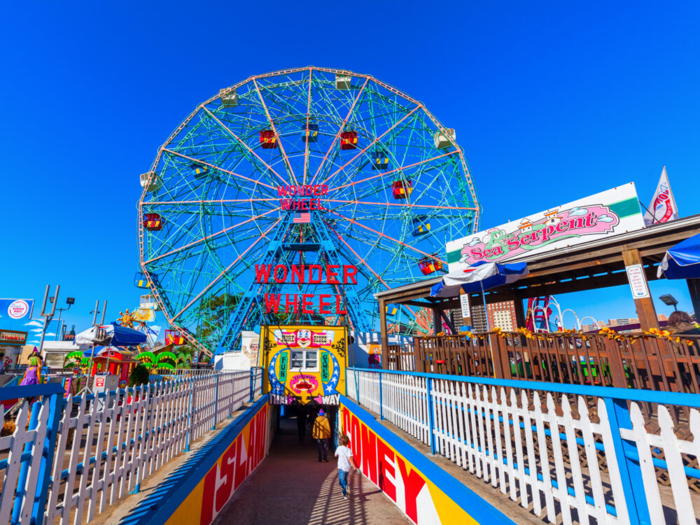 Coney Island, a must-see sight in New York City, pictured during a sunny day with blue skies