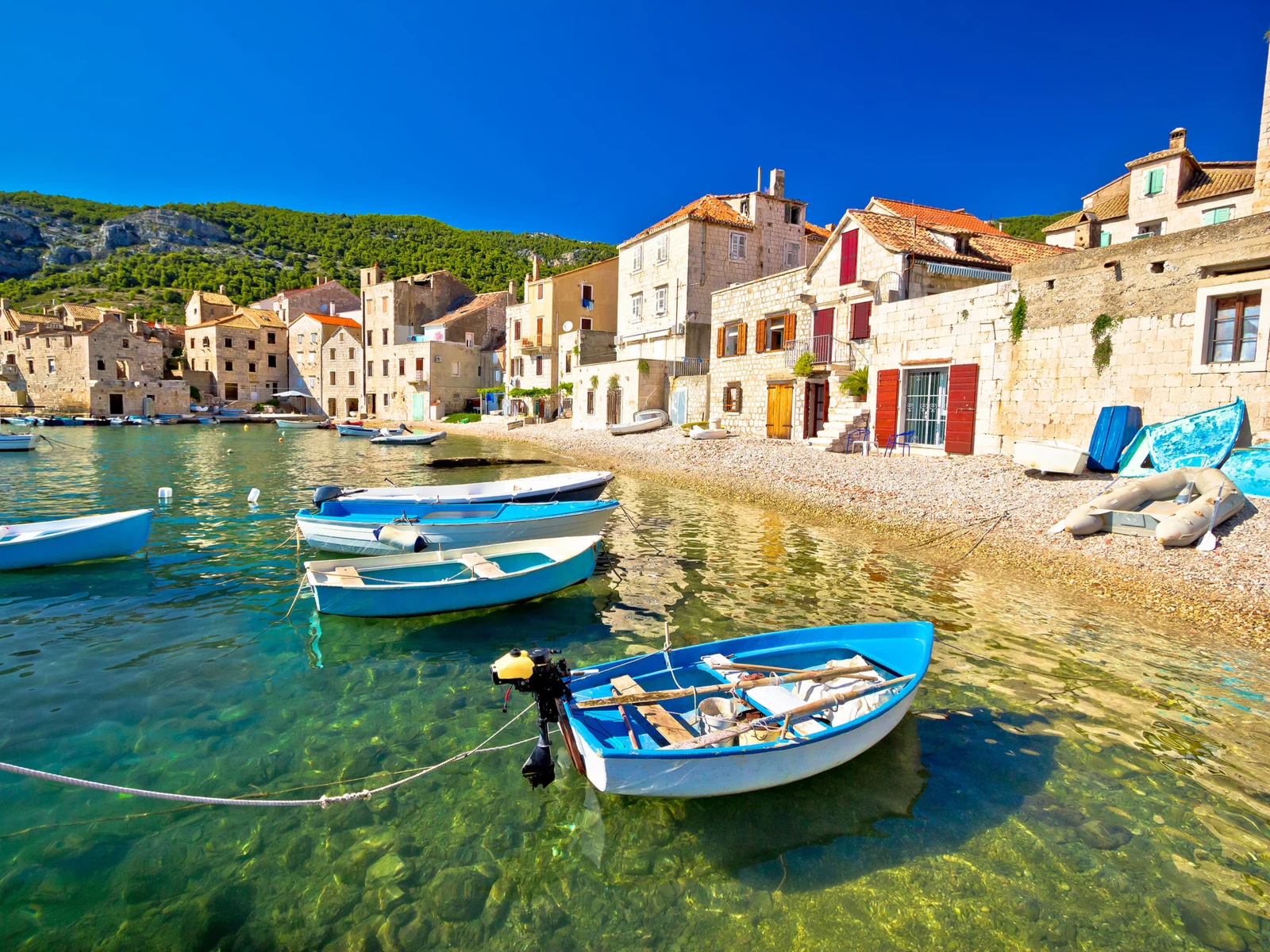 Cool view of boats on a canal in Komiza, one of the best things to do in Croatia