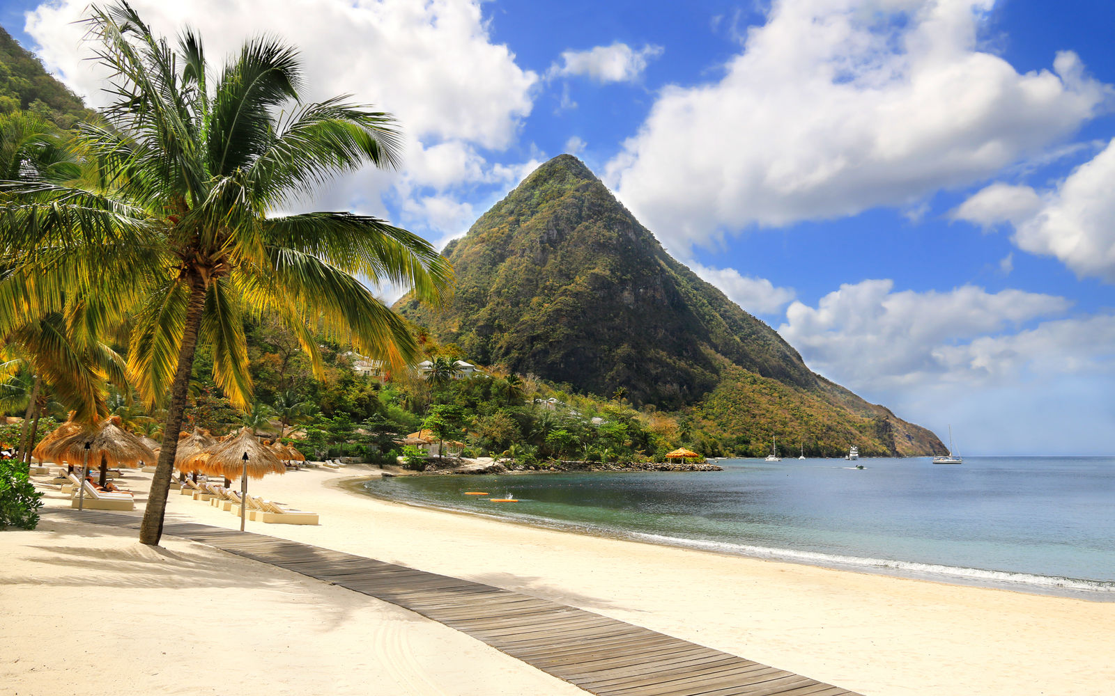 Gorgeous view of a white sand beach on one of the best places to visit in the Caribbean, St. Lucia