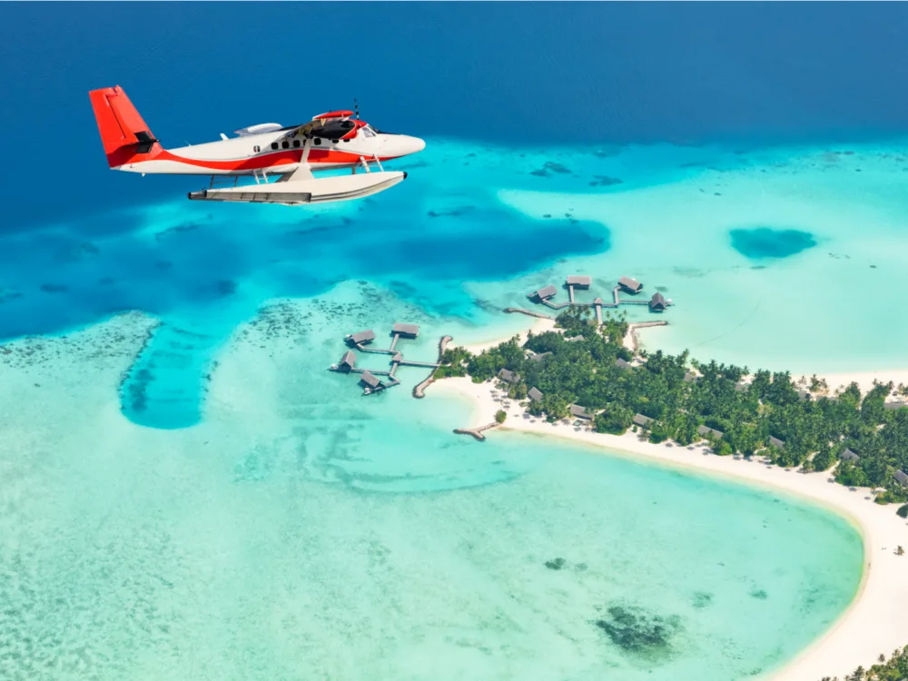 Seaplane flying above Maldives during the best time to visit