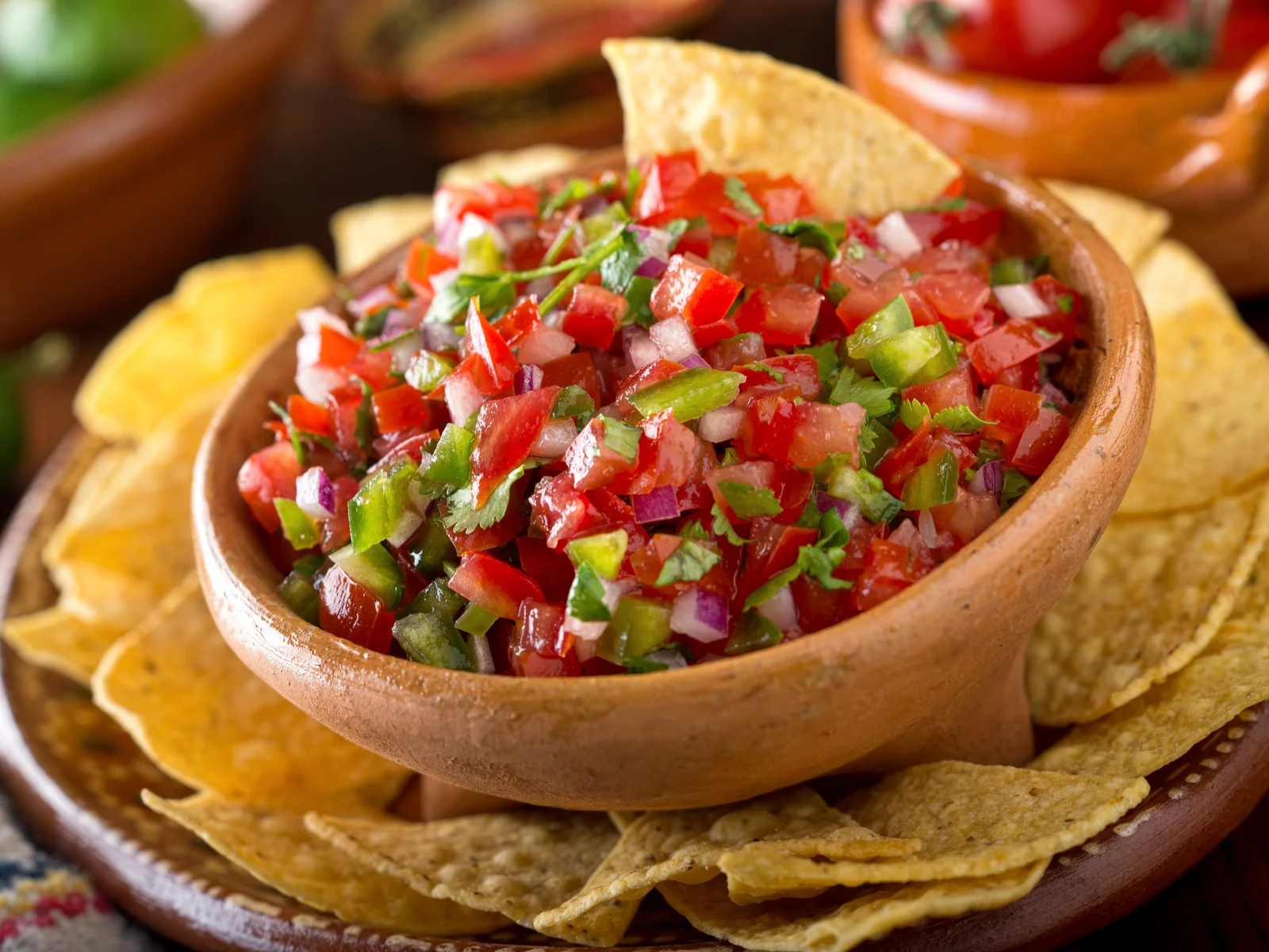 Homemade salsa in a wooden bowl for a piece on the best things to do in Phoenix