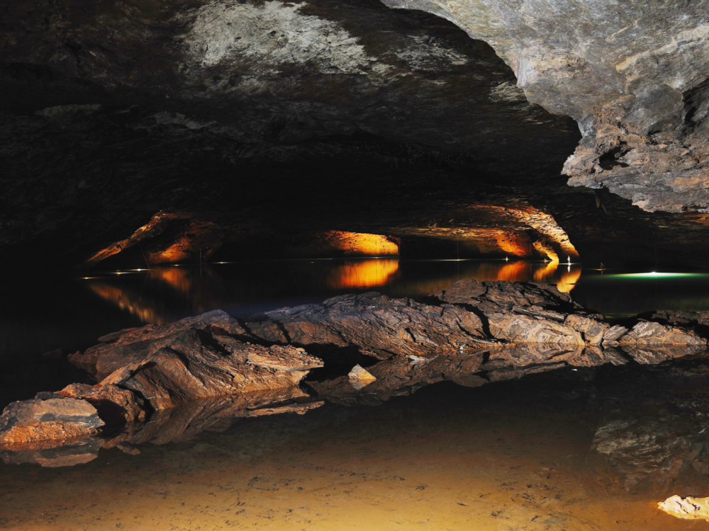 An illuminated underground lake in Lost Sea Cave, one of the best places to visit in Tennessee
