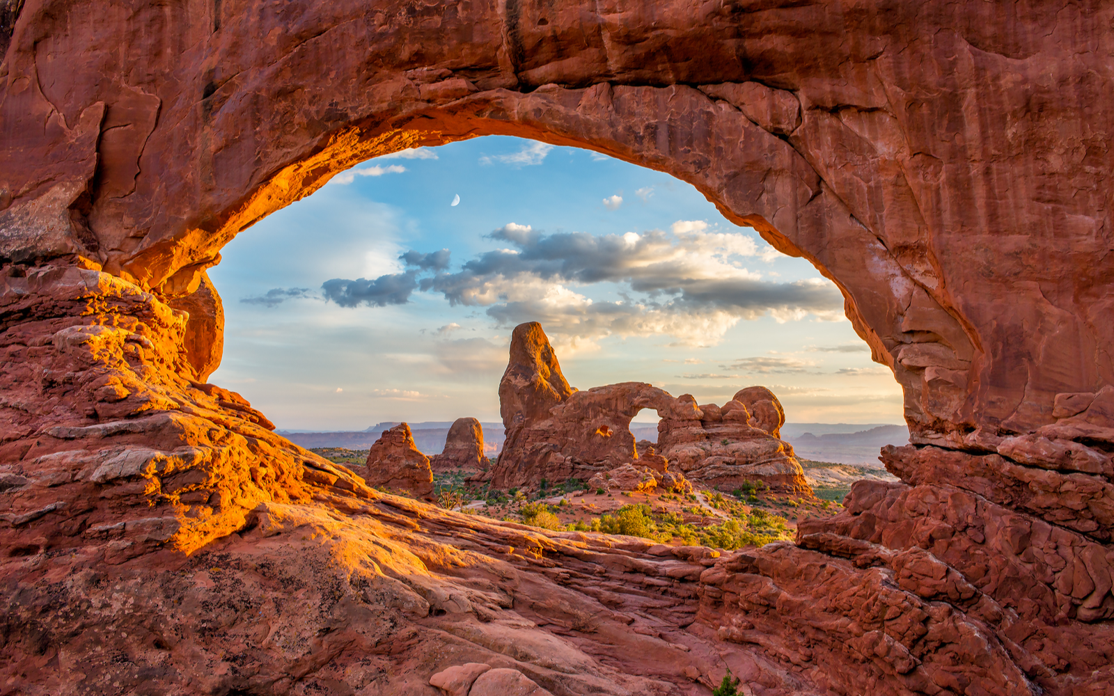 Cool view of the Arches at one of the best places to visit in Utah as viewed from a cave