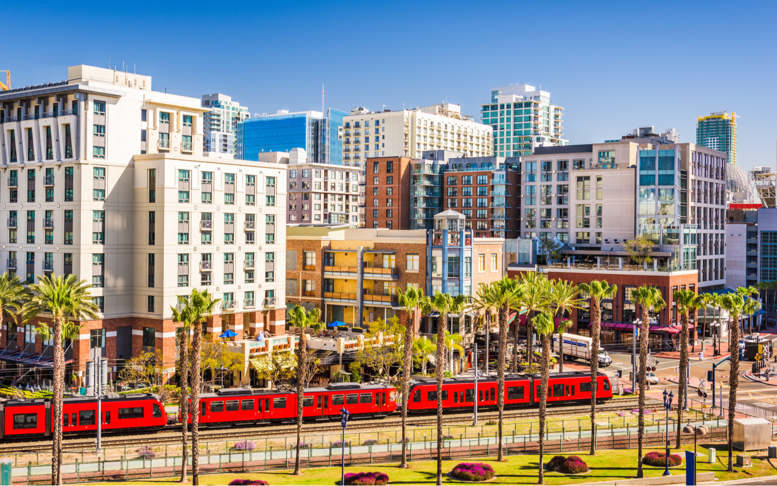 Image of the downtown skyline with a tram for a piece on the best hotels in San Diego