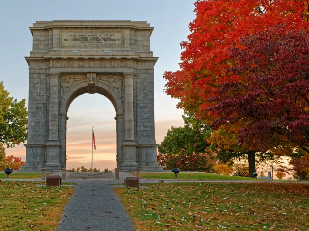 The iconic National Memorial Arch Monument, dedicated to George Washington and the United States Continental Army, is one of the best things to do in Pennsylvania during autumn at Valley Forge National Historical Park