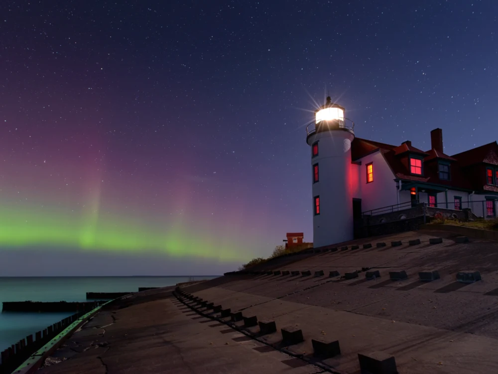 Northern lights above Point Betsie Lighthouse, one of the best places to visit in Michigan