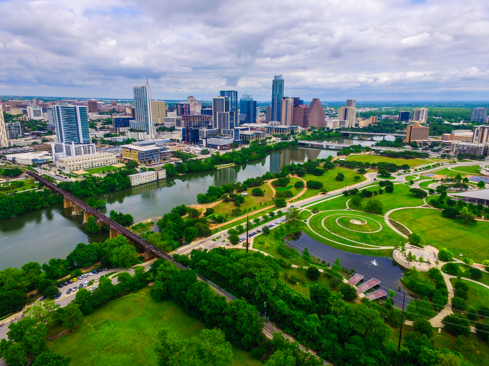 Aerial view of Lady Bird Lake and some parks during the best time to visit Austin, the Summer