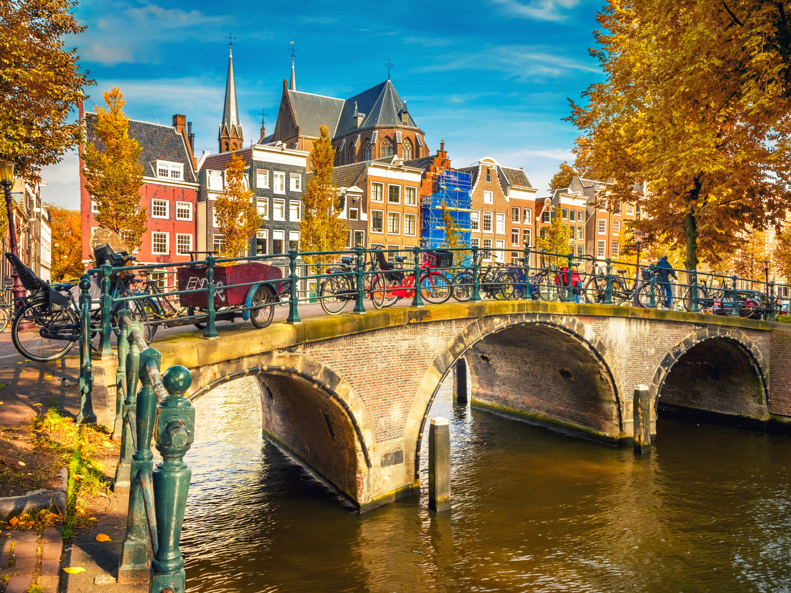 Cool bridges over a canal in Autumn, one of the best times to visit Amsterdam