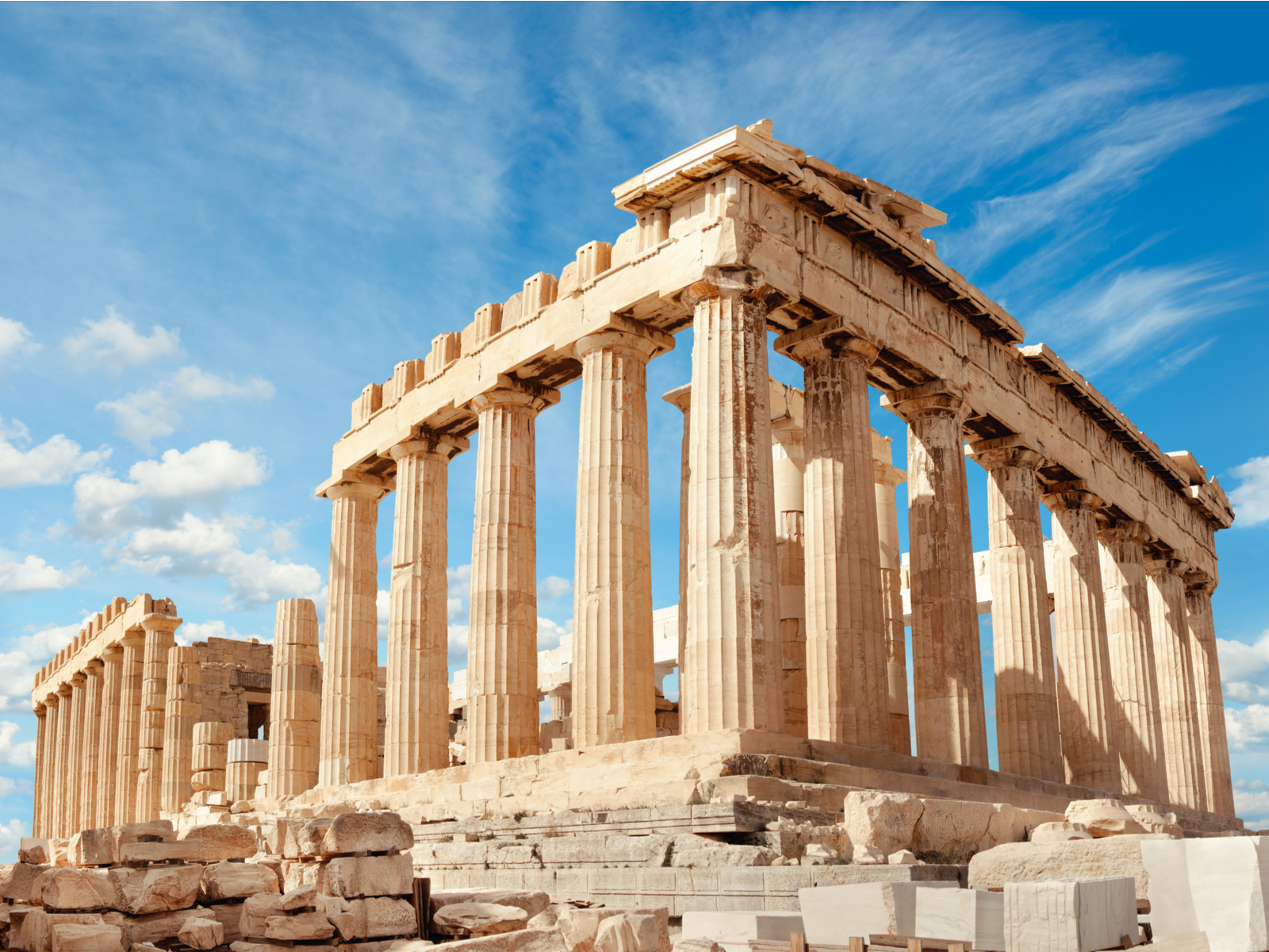 The iconic Parthenon Temple ruins at Acropolis in Athens, a piece on the best places to visit in Greece, with its columns still sturdy as of today