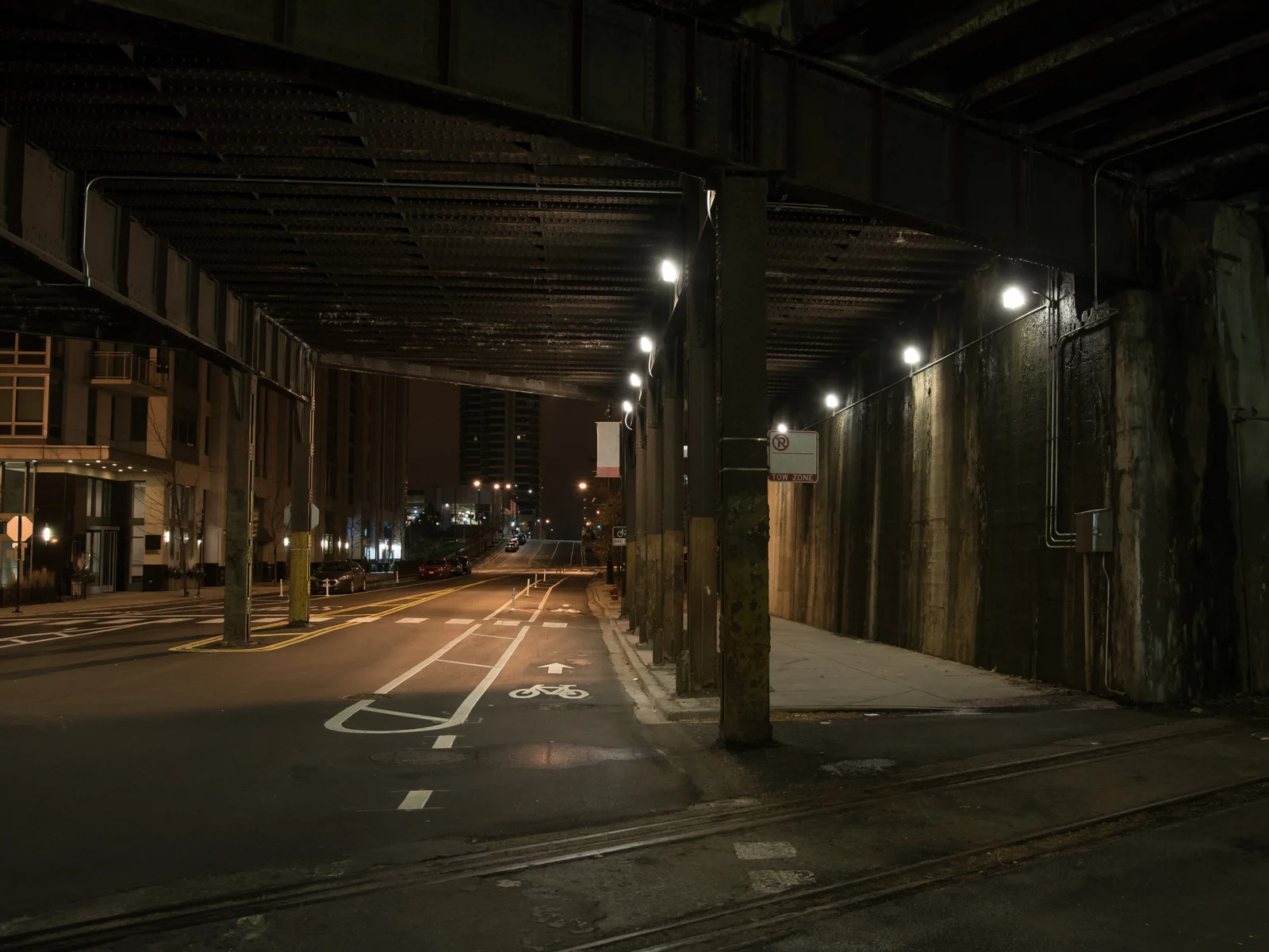Dark street below the elevated train in Chicago for a piece on is the city safe