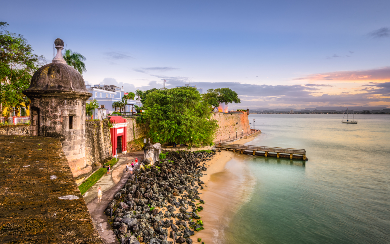 Featured image for a guide titled is Puerto Rico safe featuring the fort overlooking the ocean in San Juan
