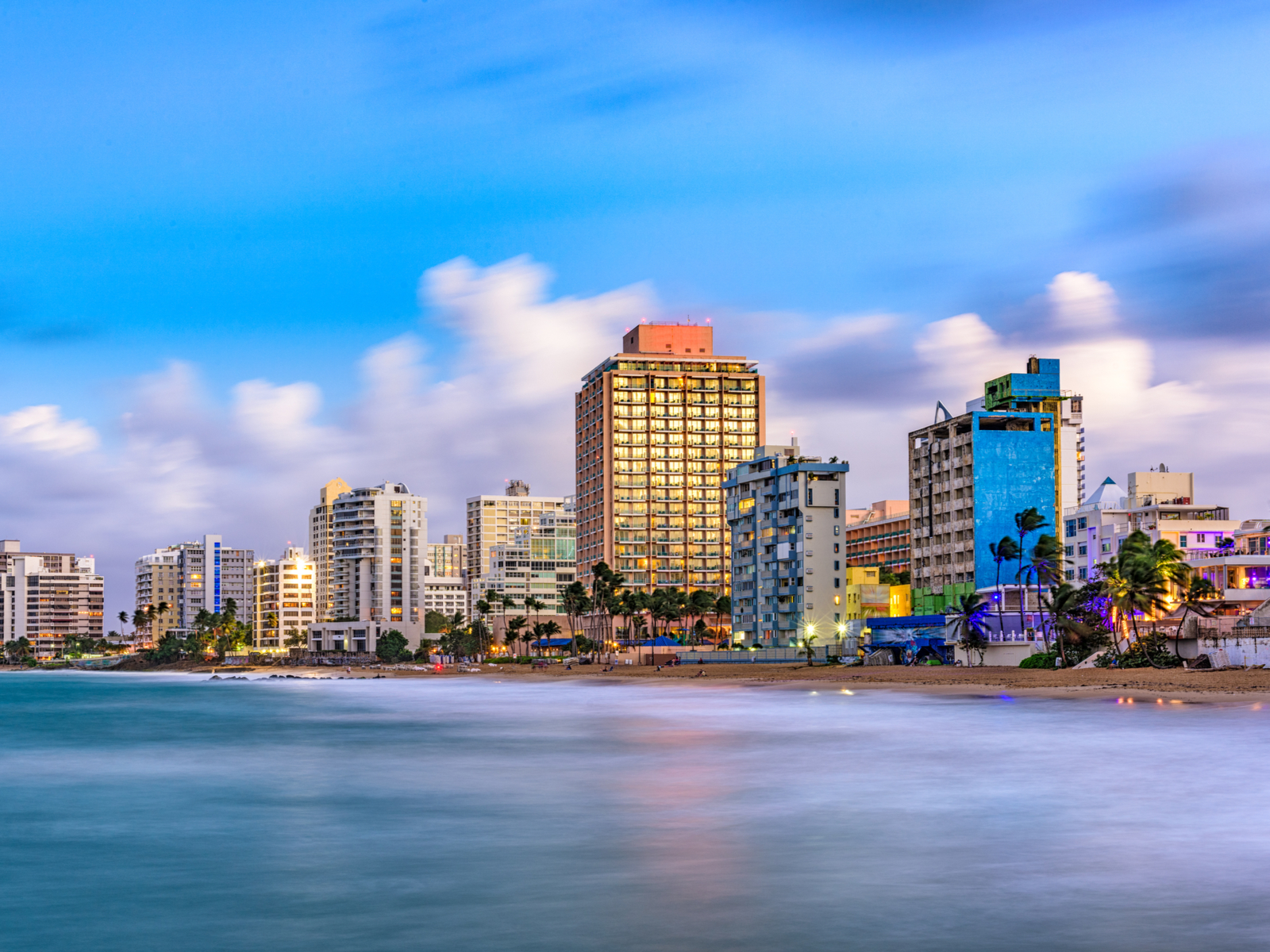Condado Beach in San Juan pictured with resorts against the blue skyline
