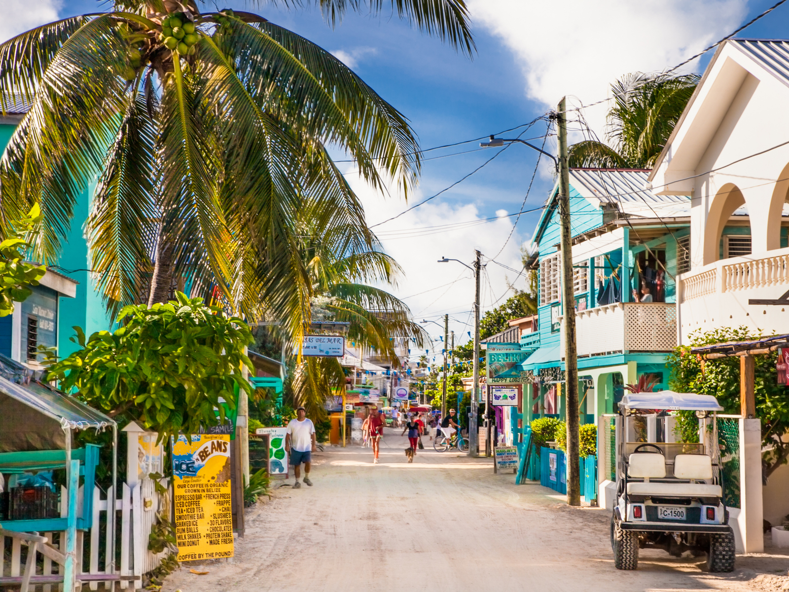 Caye Caulker in Belize with a dirt road in the middle of the town for a piece titled Is Belize Safe