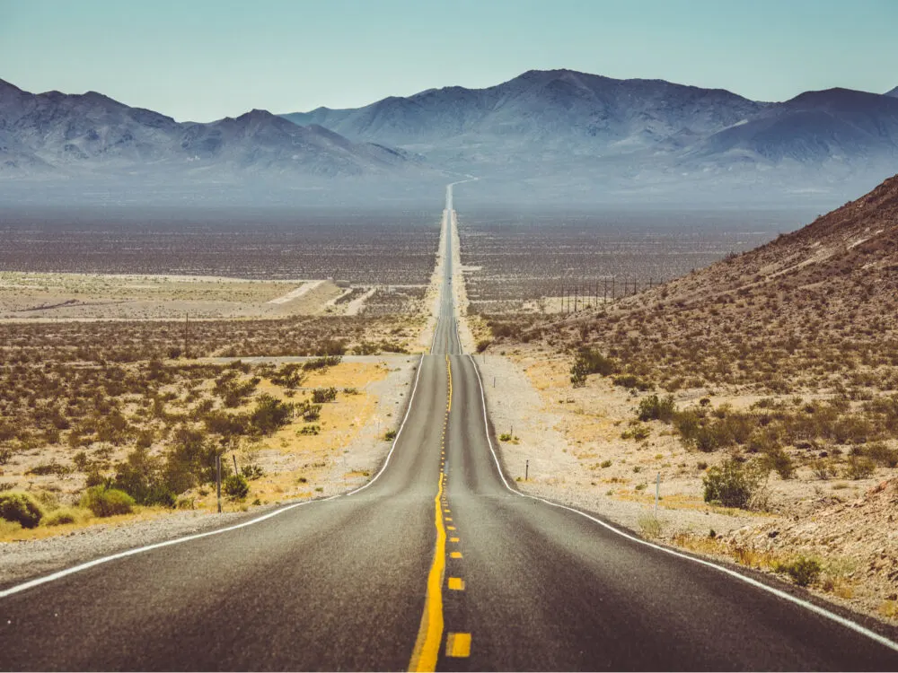 Arizona desert highway pictured during the cheapest time to visit Arizona
