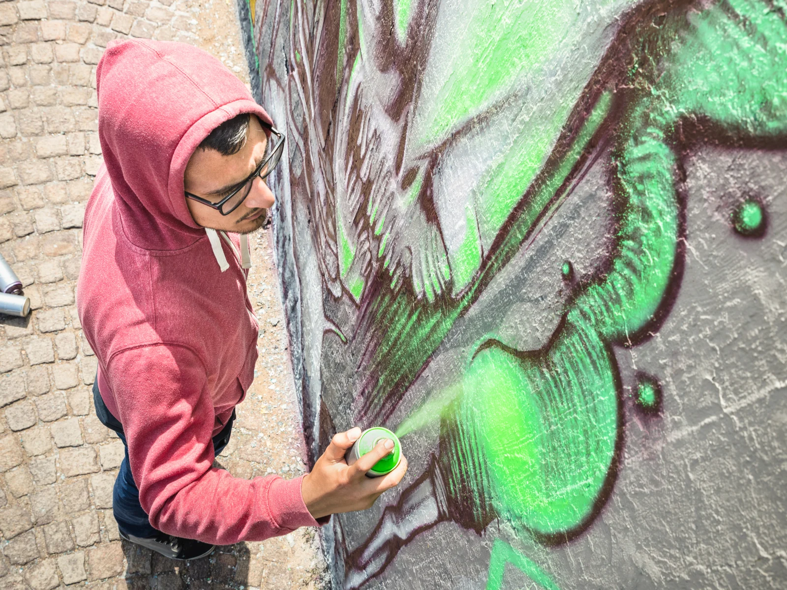 Image of a person painting a mural, one of the best things to see in Houston