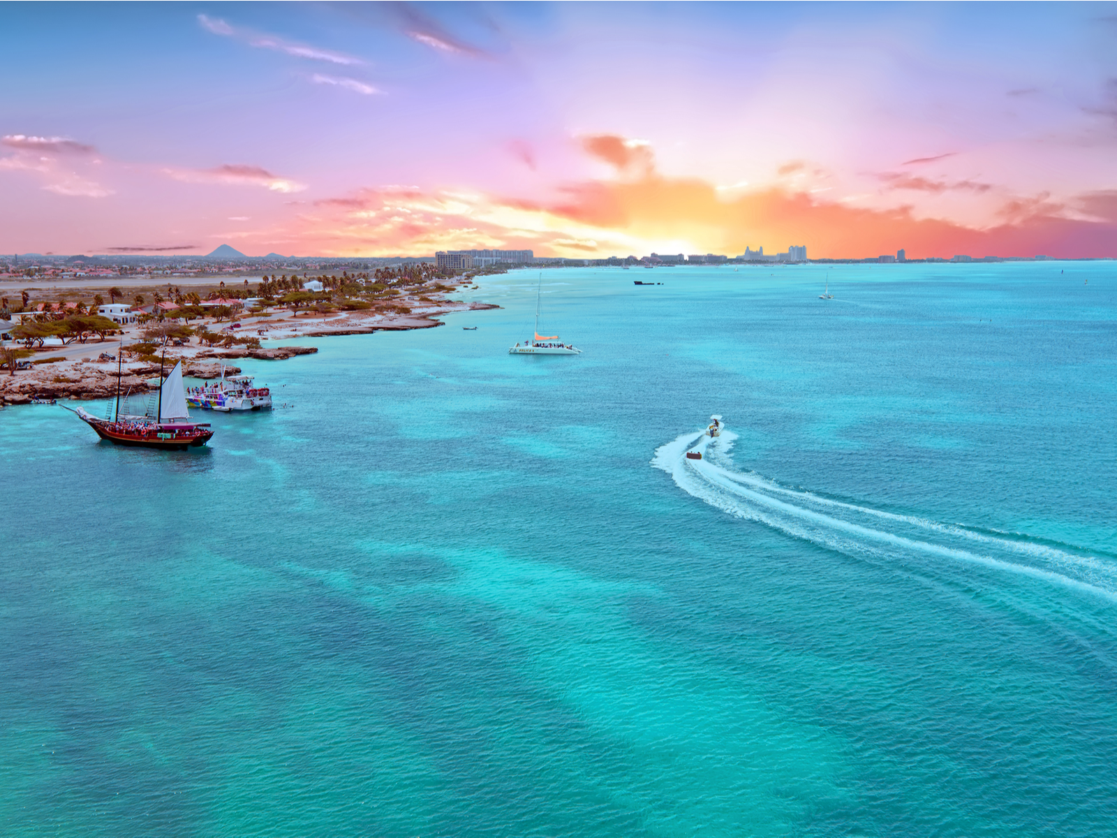Aerial from Aruba island in the Caribbean Sea at sunset for a piece on the best all-inclusive resorts in Aruba