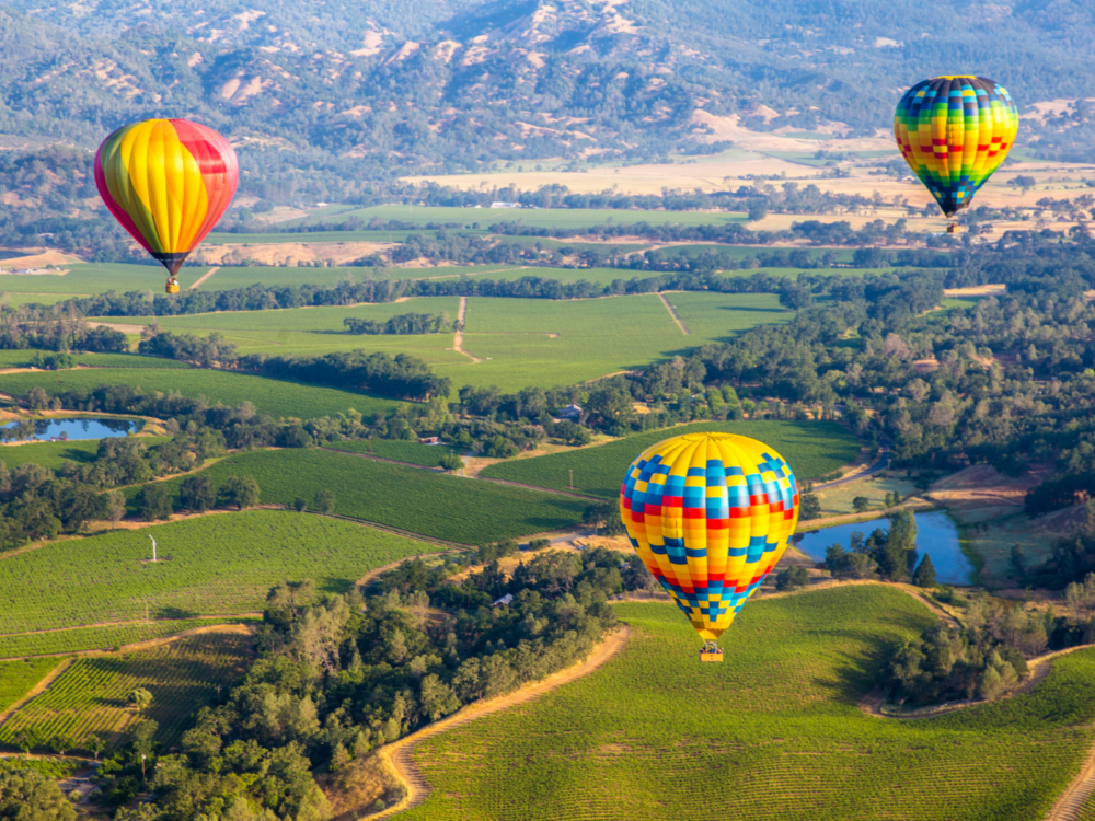 Photo of hot air balloons above Napa Valley during the best time to visit California