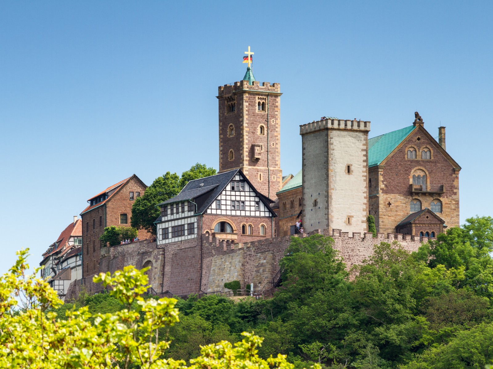 The classic Wartburg Castle, one of the best castles in Germany, a world heritage site at Eisenach where Martin Luther translated the Bible into German surrounded by thick greeneries during Spring