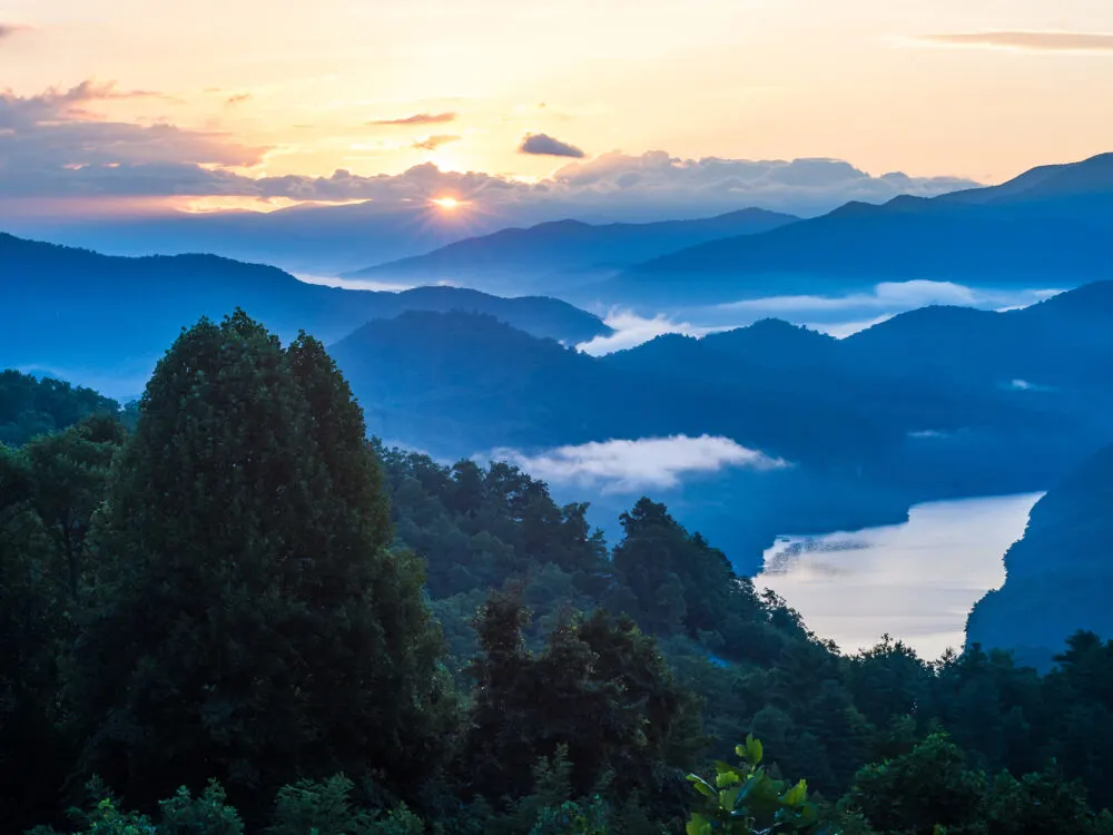 Sun rising over the vast cold Great Smoky Mountains National Park, one of the best things to do in Tennessee