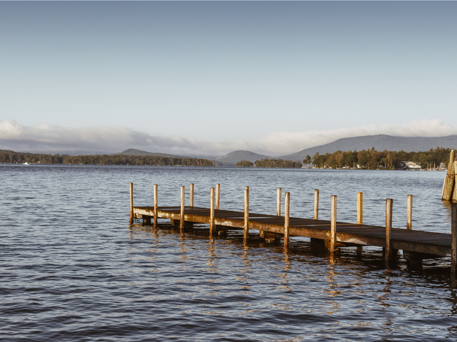 A dock ending at the deeper portion of Lake Winnipesaukee in New Hampshire, one of the best lakes in the U.S.