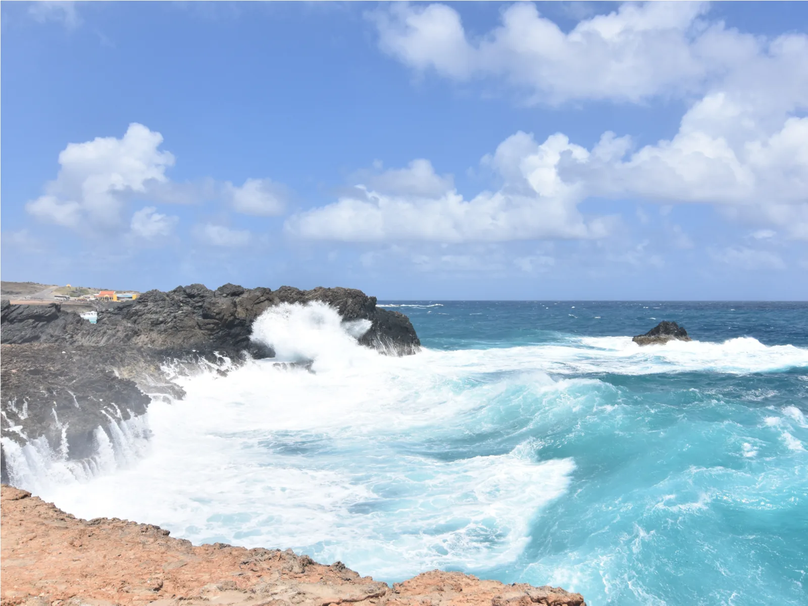 Strong waves smashing on the rocky coast of Andicuri Beach, one of the best beaches in Aruba