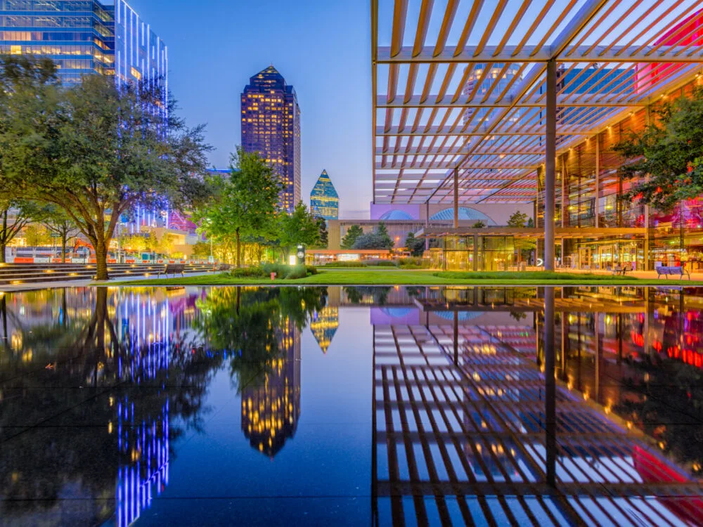 View of the reflecting pool by one of the best hotels in Dallas as viewed from downtown