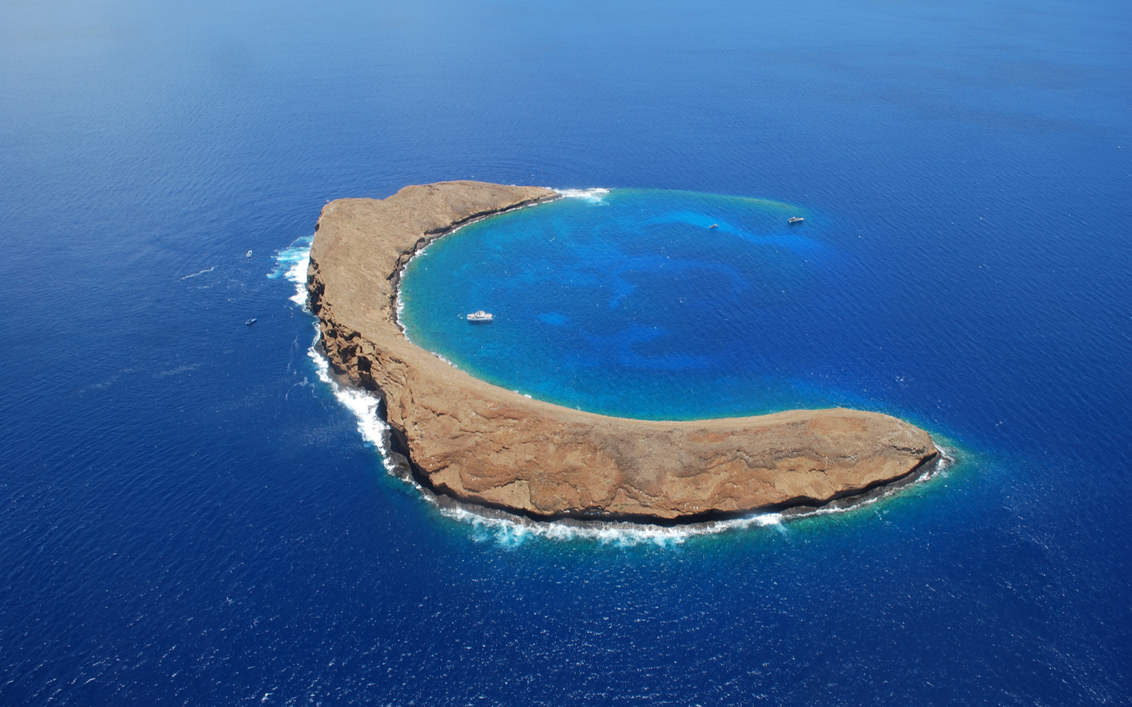 Molokini crater, one of the best Hawaiian snorkeling spots, as seen from above