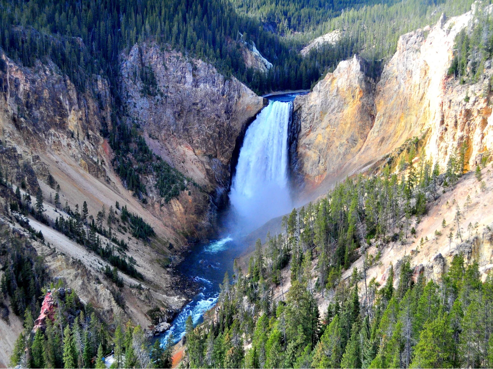 Neat view of a canyon with a waterfall for a piece titled Where to Stay in Yellowstone