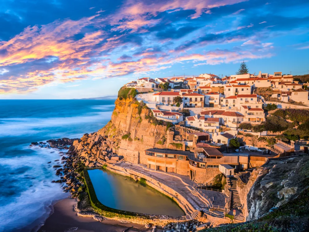 Azenhas do Mar, one of the best places to visit in Portugal, pictured on a cliffside