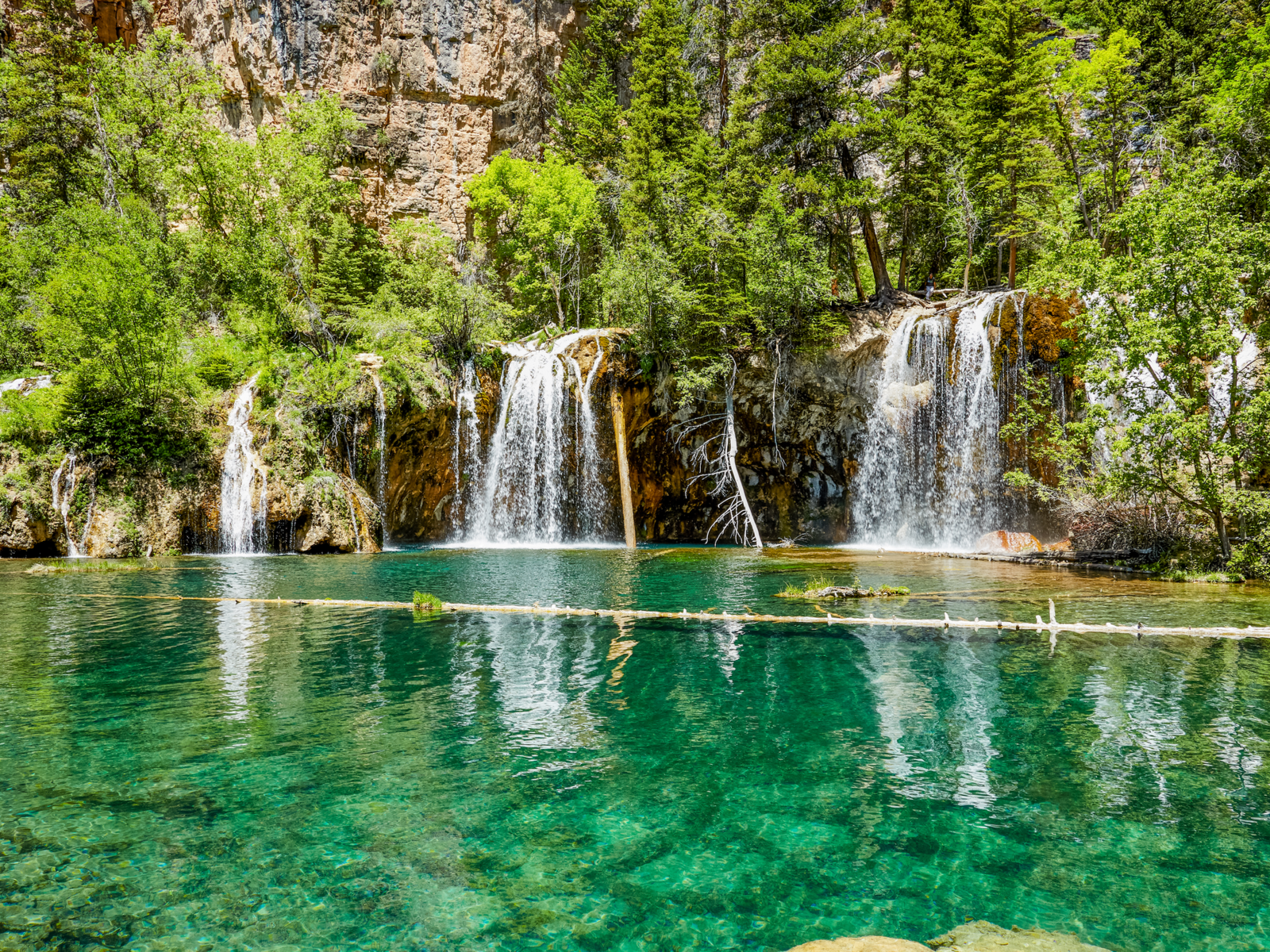 Clear emerald water at a waterfalls on Hanging Lake in Colorado, considered as one of the best lakes in the U.S.
