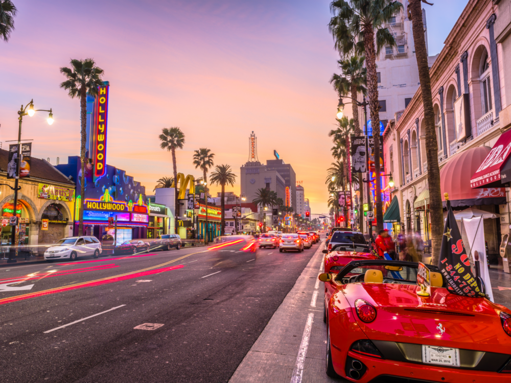 Luxury cars outside the best hotel in Los Angeles with lots of traffic on the street