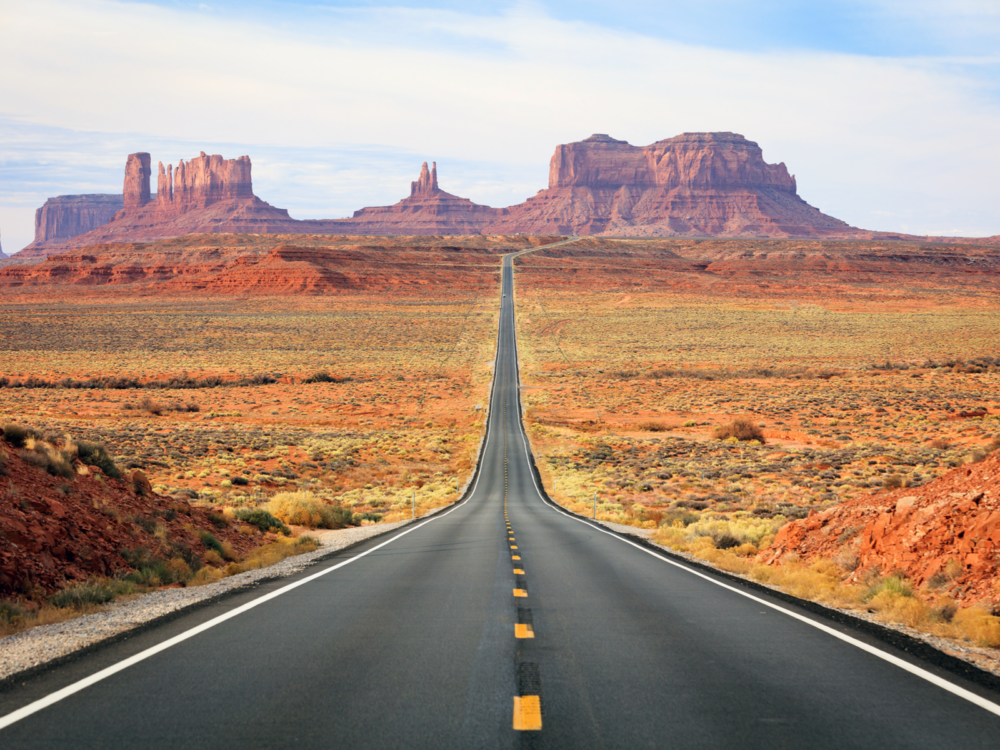 Amazing view of a road leading to monument valley, one of our picks for the best places to visit in Arizona