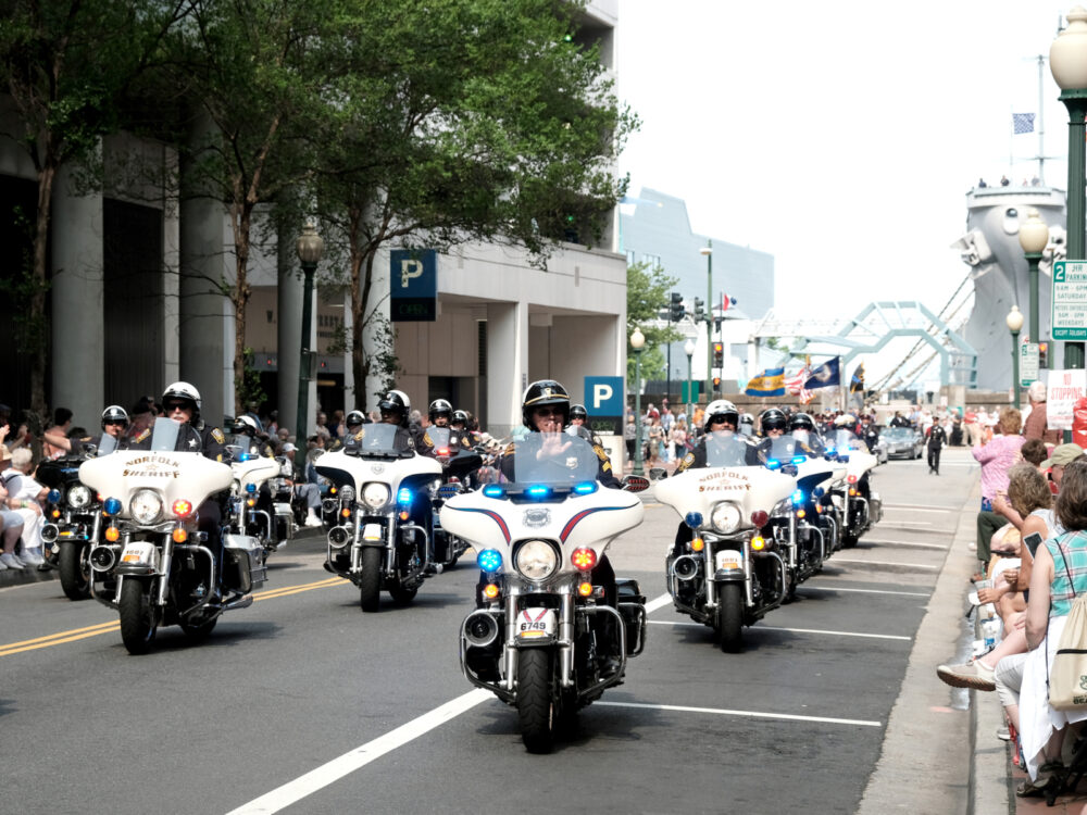 Police on motorcycles driving down the street for a piece on the best things to do in Virginia