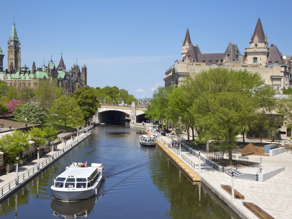 Two boats traversing the wide and famous Rideau Canal in Ontario, one of the best places to visit in Canada