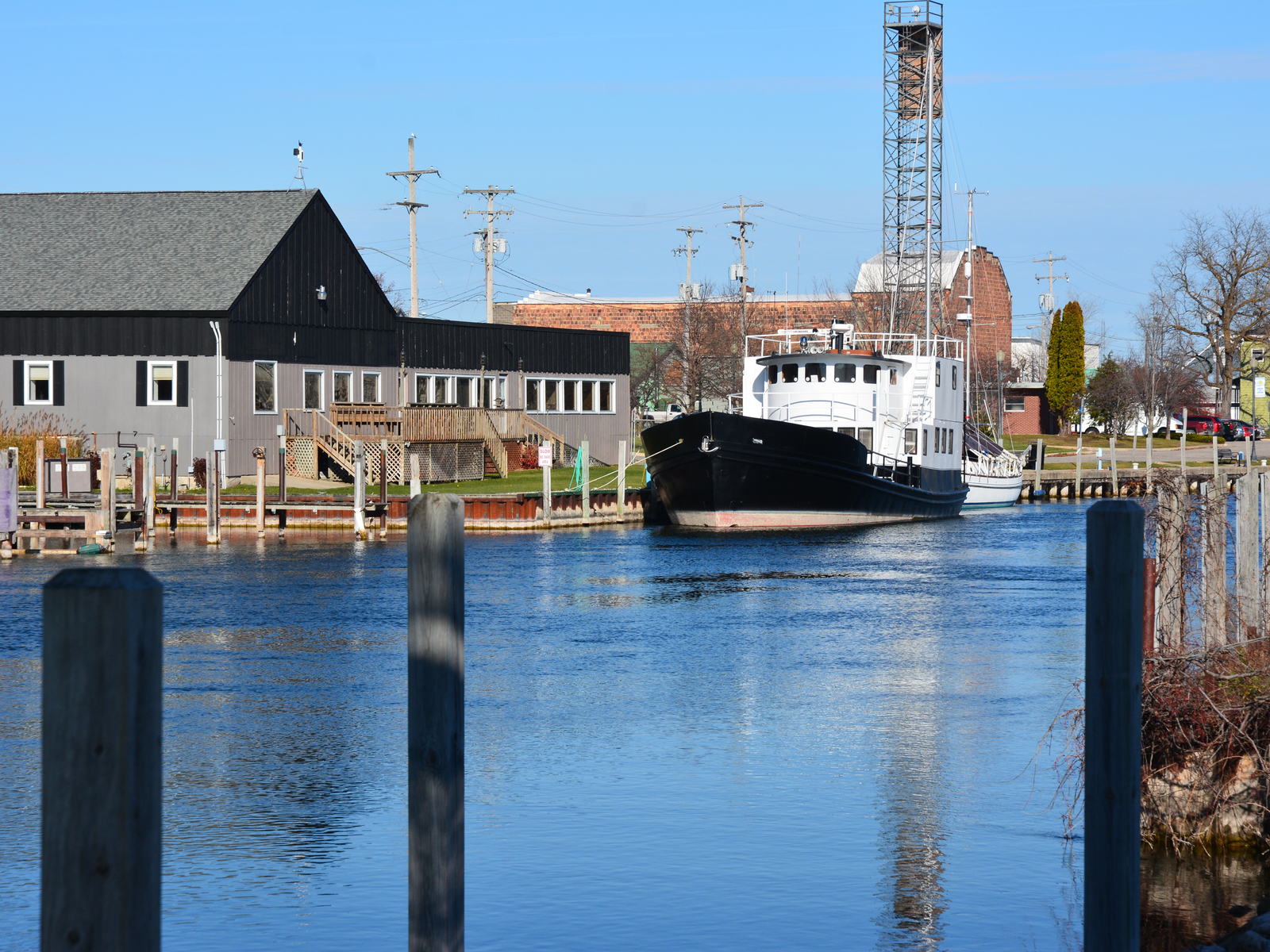 Fishing boat on a river in Cheboygan, a top picks for the best places to visit in Michigan