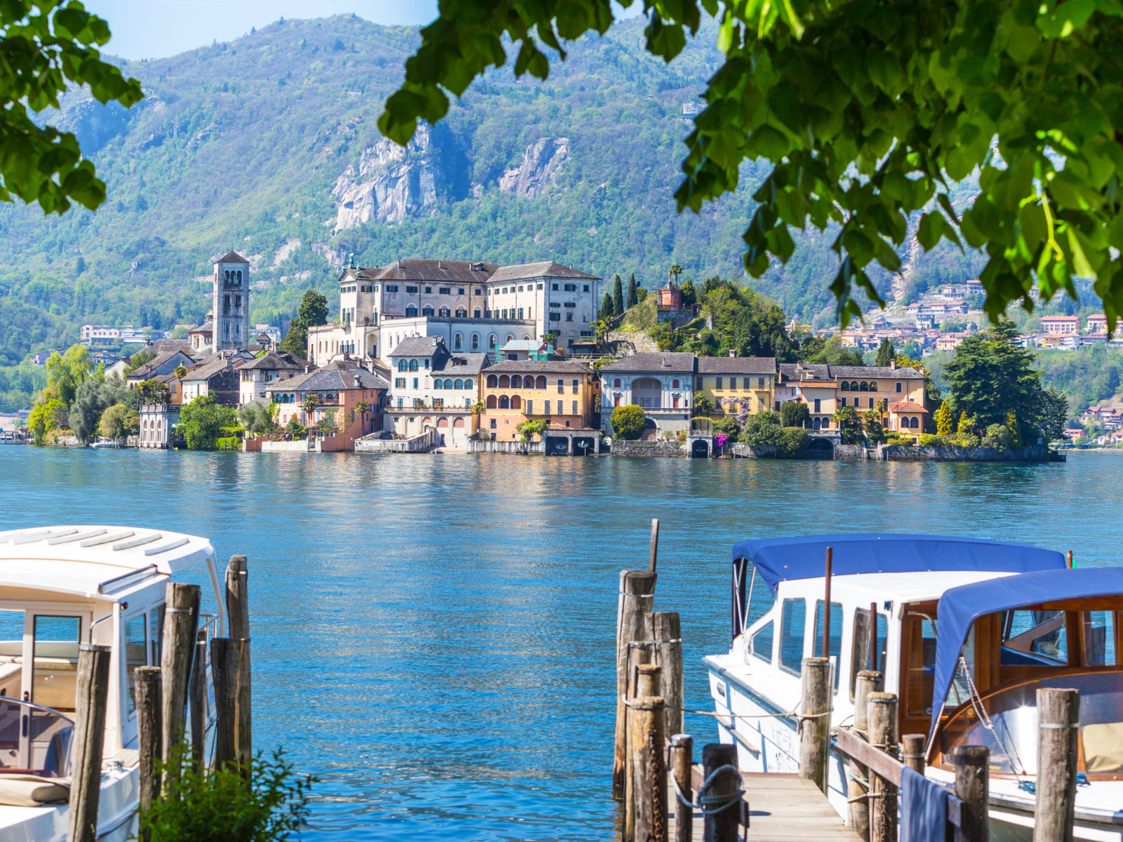 For a piece on the best places to visit in Italy, a dock overlooking San Giulio Island on Laek Orta