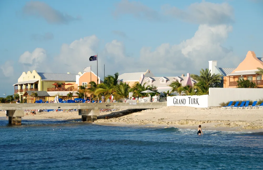 Waterfront view of Grand Turk with its beige sand and deep blue water