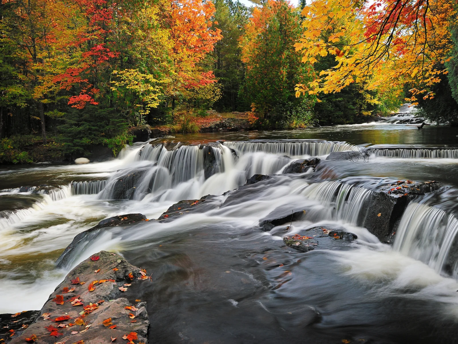 Bond Falls pictured in Autumn for a roundup of the best places to visit in Michigan