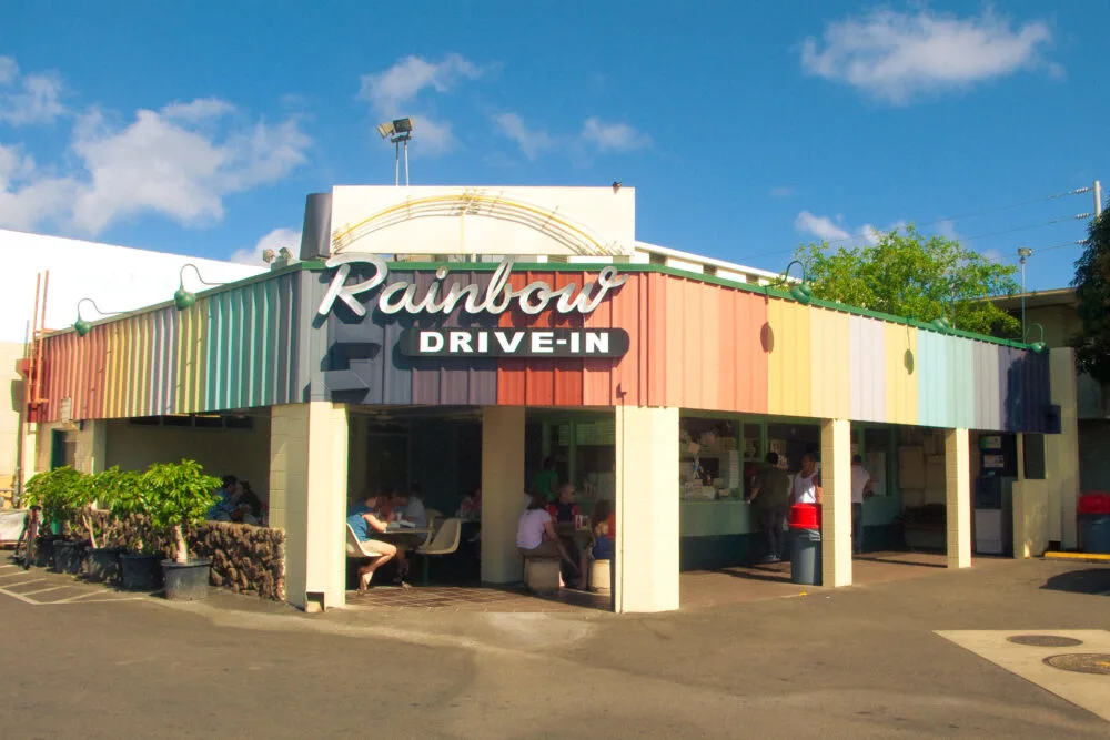 Vibrant storefront of Rainbows Drive-In, an American Hawaiian restaurant and considered one of the best restaurants in Oahu, with few diners seen eating inside the restaurant