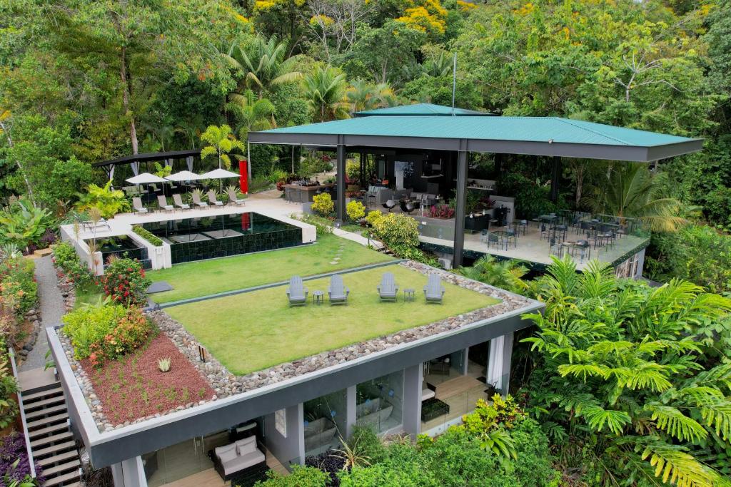 Aerial view of Ranco Pacifico, one of the best all-inclusive resorts in Costa Rica, with a green grass lawn on top of several of the VIP villas