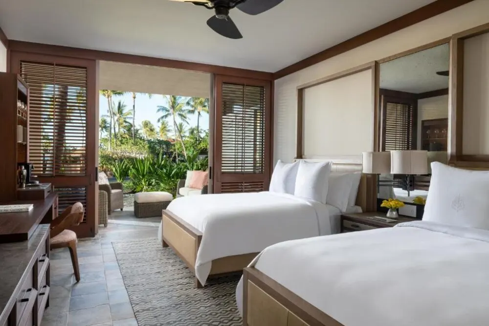 Breathtaking view of two queen beds at the Four Seasons, one of the best hotels in Kona