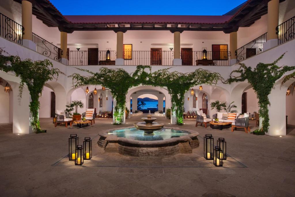 Lobby area of the Zoetry Casa del Mar, one of the best all-inclusive resorts in Cabo, pictured at night